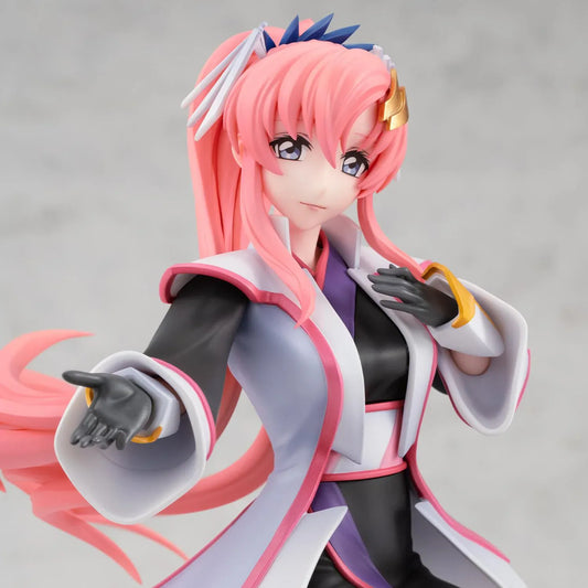 Gundam Girls Generation Lacus Clyne Battle Surcoat Ver. figure with flowing pink hair, a white surcoat with pink trim, and one gloved hand extended.
