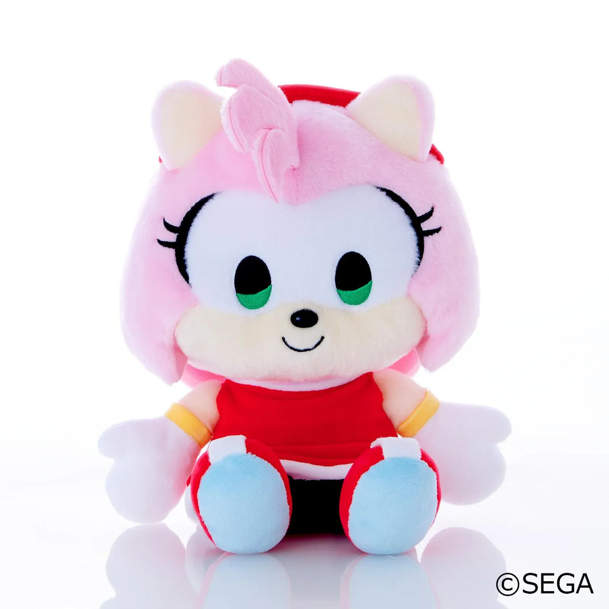 Sonic & Friends Amy medium plush with green eyes, a red dress, white gloves, and red shoes.