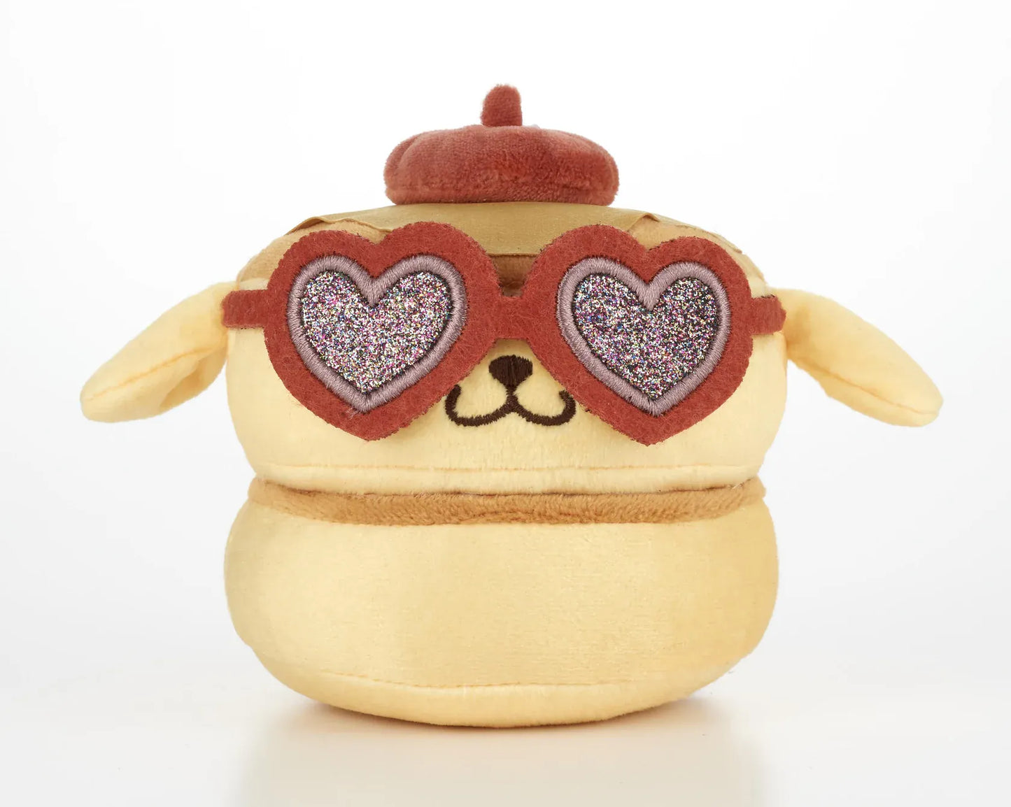 Kawaii YumYum MART DINER Pompompurin Pancakes plushie featuring layered pancake details, floppy ears, a brown beret, and sparkly heart-shaped sunglasses.