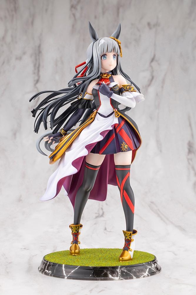 Umamusume Pretty Derby Chrono Genesis 1/7 Scale Figure featuring a silver-gray-haired horse girl with blue eyes, horse ears, and a flowing white, black, red, and gold racing outfit standing on a grassy display base.