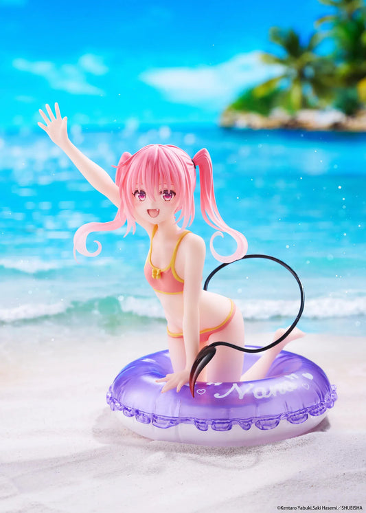 To Love-Ru Darkness Aqua Float Girls Nana figure featuring Nana with pink twin tails in a swimsuit posing on a purple float ring display base