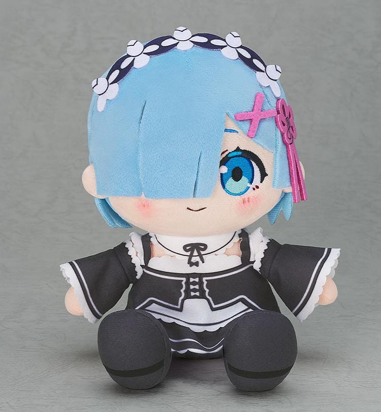 Re Starting Life in Another World Rem Chocopuni Plushie (Rerelease) featuring short blue hair covering one eye, a bright blue embroidered eye, pink hair accessories, a floral headband, and a black and white maid outfit in a seated chibi design.