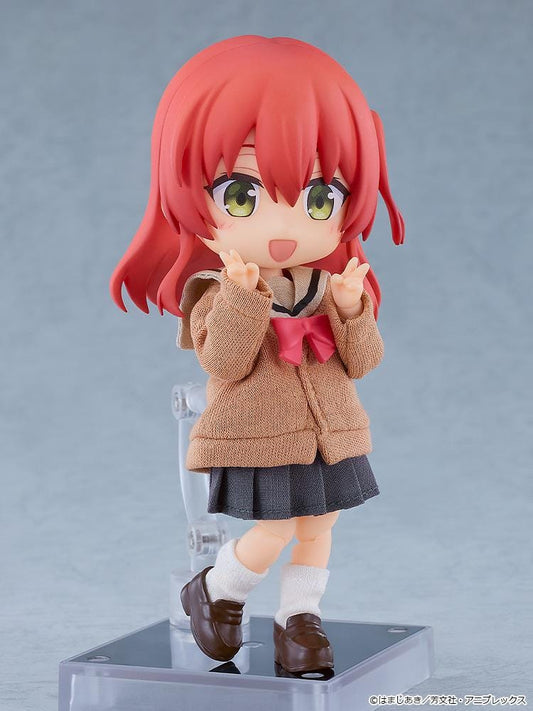 Bocchi the Rock Nendoroid Doll Ikuyo Kita featuring Kita with red hair, green eyes, a fabric cardigan outfit, skirt, socks, and loafers.