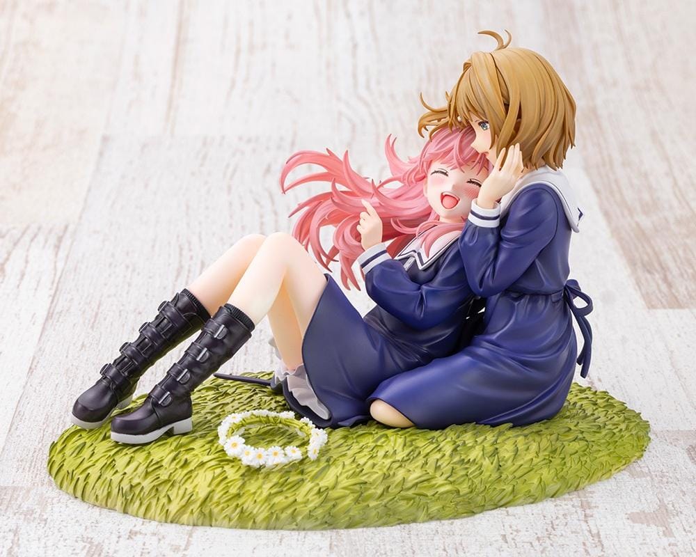 I Want to Love You Till Your Dying Day Sheena & Mimi 1/8 Scale Figure featuring pink-haired Sheena smiling with her eyes closed while leaning against blonde-haired Mimi. Both wear navy-blue school-inspired dresses and sit together on a textured grassy display base decorated with a white daisy flower crown.