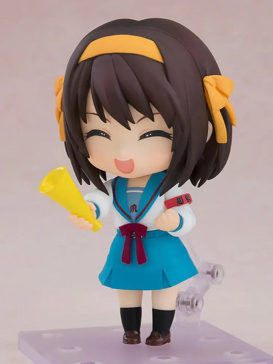 The Melancholy of Haruhi Suzumiya Nendoroid Haruhi Suzumiya 2.0 figure in school uniform with yellow headband and SOS armband.