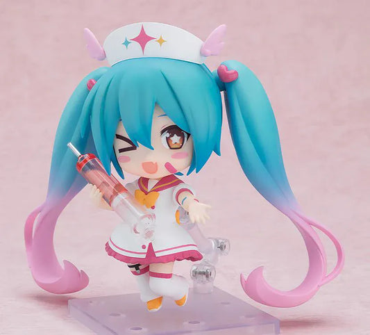 Hatsune Miku Nendoroid MAGICAL CURE LOVE SHOT Figure with teal pink twin-tails, magical nurse outfit, heart details, and starry eyes