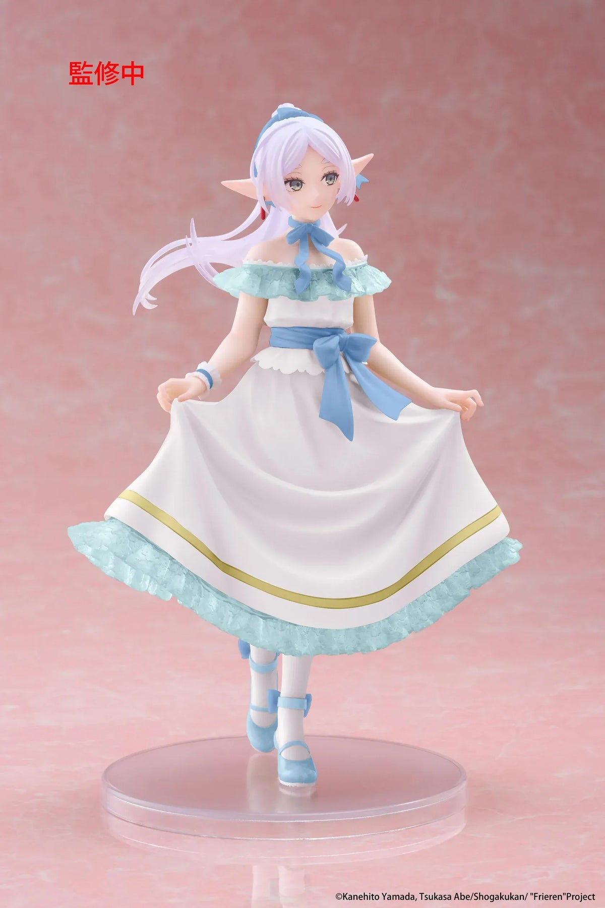 Frieren Beyond Journey's End Frieren Party Dress Ver. Coreful Figure (Rerelease) featuring a silver-white-haired elf with green eyes wearing an elegant white off-the-shoulder dress with light-blue ruffles, golden trim, blue ribbons, and matching heels while gracefully holding her skirt on a transparent circular base.