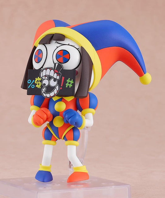 The Amazing Digital Circus Nendoroid Pomni Figure Rerelease featuring Pomni in a colorful red, blue, and yellow jester outfit with oversized hat and mismatched shoes.