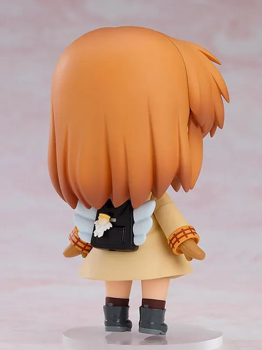 Kanon Nendoroid Ayu Tsukimiya figure featuring short brown hair, a red headband, cream duffle coat, mittens, black boots, and white wing details.