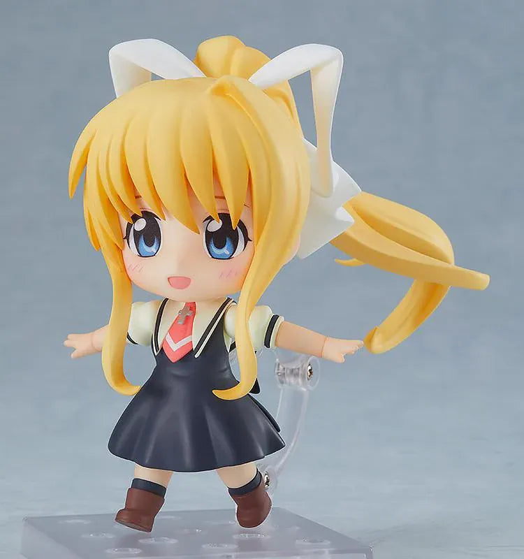 KAGINADO Nendoroid Misuzu Kamio figure featuring blue eyes, long blonde hair, an oversized white ribbon, a dark school dress, and a red necktie.