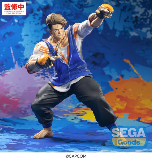 Street Fighter 6 FiGURiZMa Luke Figure in a dynamic fighting stance with blue and orange outfit and fingerless gloves