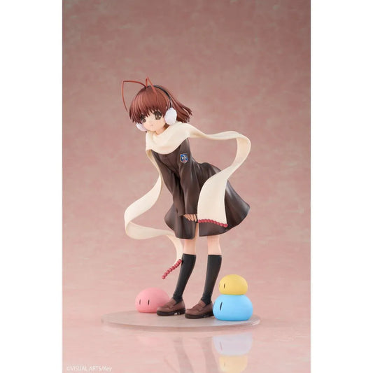 CLANNAD Nagisa Furukawa 1/6 Scale Figure featuring a smiling brown-haired anime girl wearing a dark school uniform, cream-colored scarf, white earmuffs, and black knee-high socks, surrounded by colorful Dango Daikazoku characters.
