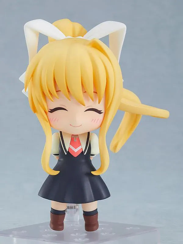 KAGINADO Nendoroid Misuzu Kamio figure featuring blue eyes, long blonde hair, an oversized white ribbon, a dark school dress, and a red necktie.