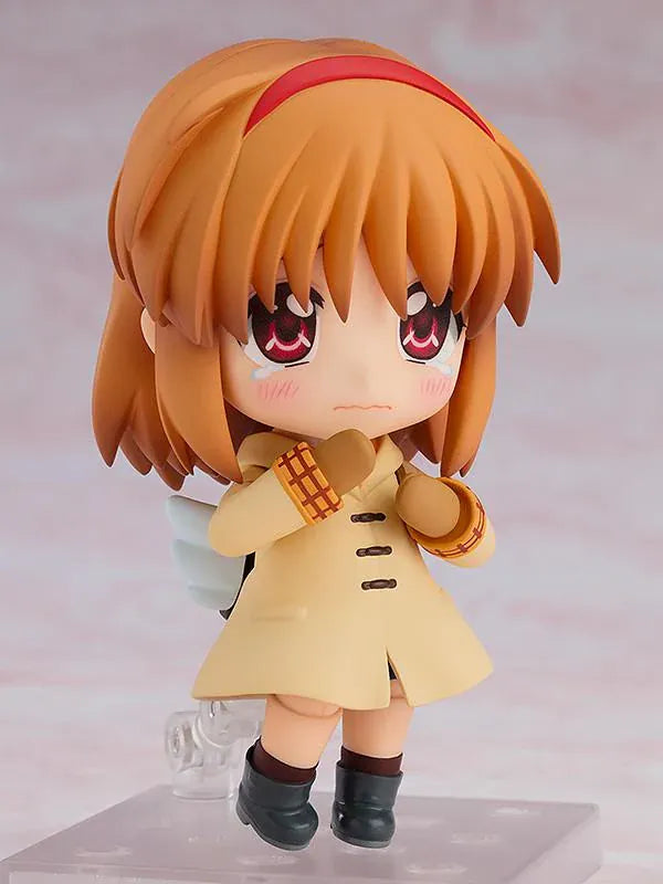 Kanon Nendoroid Ayu Tsukimiya figure featuring short brown hair, a red headband, cream duffle coat, mittens, black boots, and white wing details.