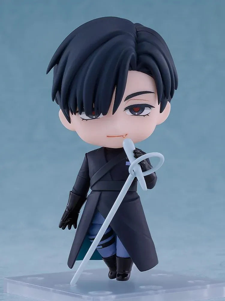 ALIEN STAGE Nendoroid Ivan Figure featuring a black-haired anime character with dark eyes, a small fang, a dark long-sleeved outfit, black gloves, and matching boots while holding a light-blue accessory.