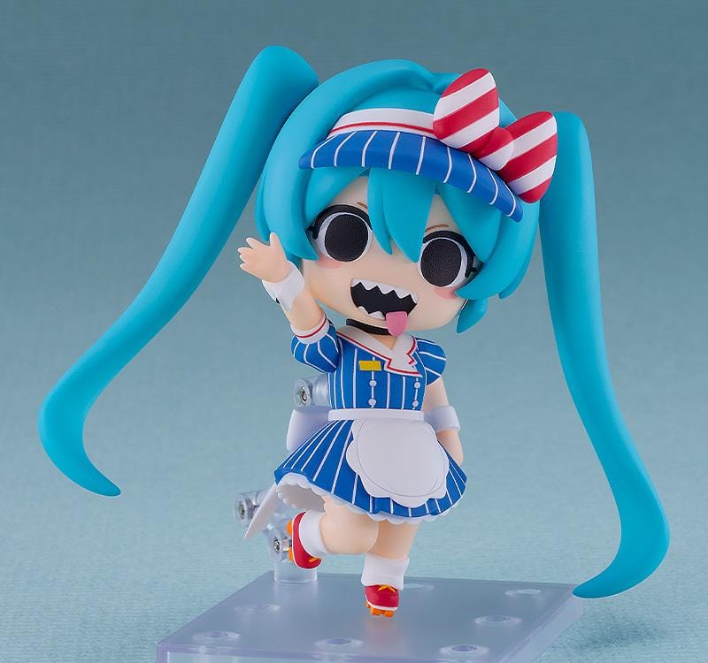 Hatsune Miku Nendoroid Hatsune Miku Mesmerizer Ver. Figure featuring Miku in a chibi-style design with teal twin tails, striped blue outfit, red and white bow, and apron-style details.