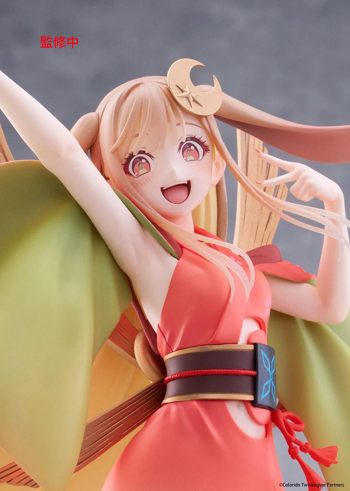 Cosmic Princess Kaguya! Kaguya VR Ver. Coreful Figure featuring a blonde-haired anime girl with pink eyes, long flowing hair, bunny ears, a crescent moon hair accessory, a coral-pink outfit with green sleeves, and colorful shoes in an energetic pose on a transparent circular base.
