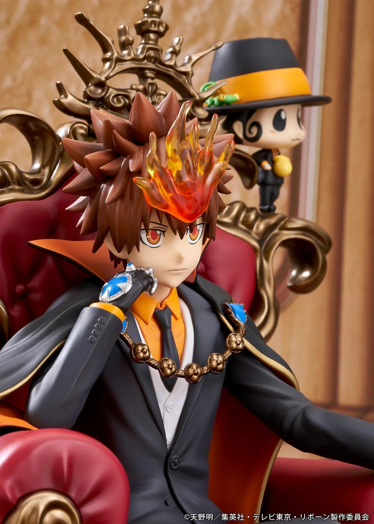 REBORN! Tsunayoshi Sawada & Reborn Scale Figure featuring Tsuna with spiky brown hair, a fiery Dying Will Flame, black suit, and orange-lined cape seated on an ornate golden throne with red upholstery, accompanied by Reborn in his signature fedora.