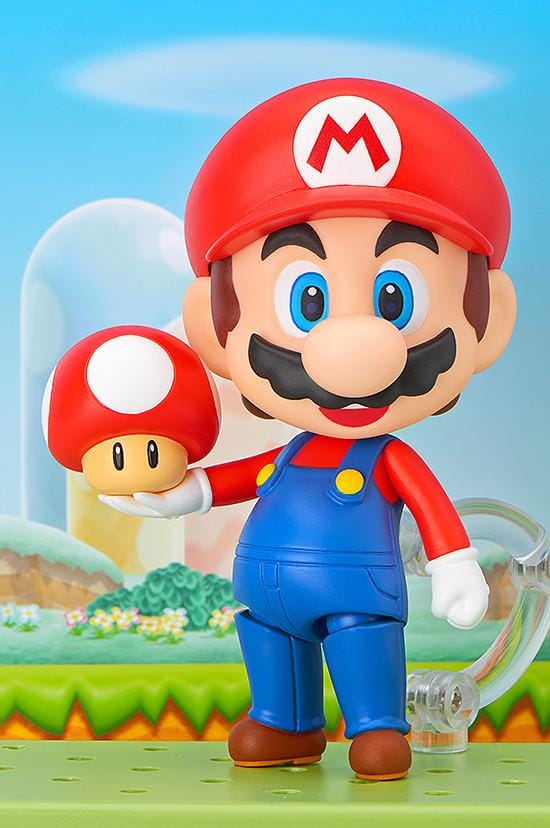 Super Mario Nendoroid Mario figure wearing his red hat and blue overalls in a running pose