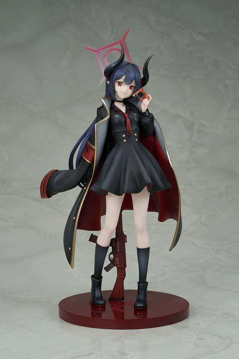 Blue Archive Chiaki 1/7 scale figure wearing dark uniform with long coat holding camera and rifle accessory.
