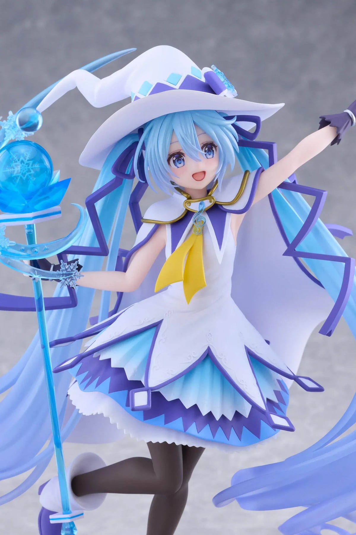 Snow Miku All Stars 2014 Ver. AMP+ figure wearing a white-and-blue snow sorceress outfit and holding a translucent magical staff.