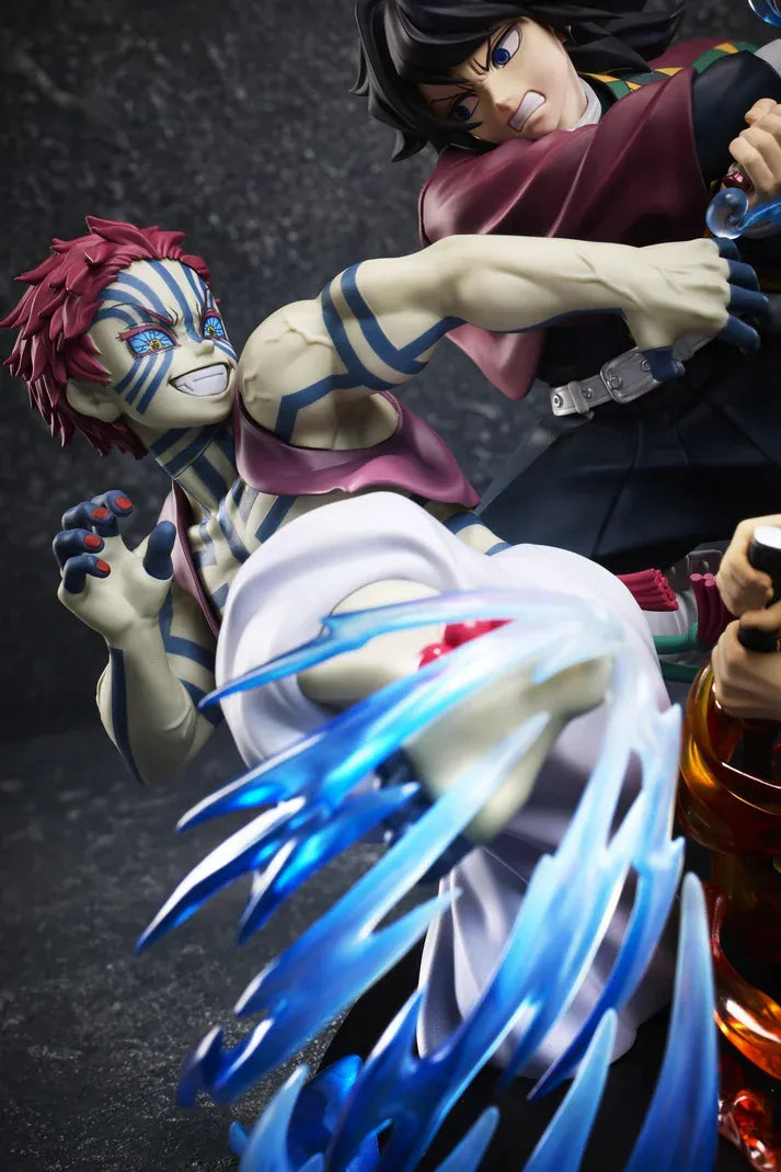Demon Slayer Tanjiro Kamado, Giyu Tomioka, and Akaza vignette figure featuring translucent water and fire battle effects.