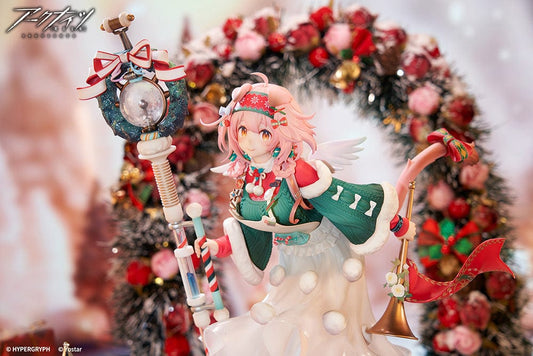 Arknights Goldenglow Maiden for the Bright Night 1/7 Scale Figure, featuring Goldenglow in a festive Christmas outfit with a staff and gifts around her, set on a snowy base, capturing the essence of holiday cheer.