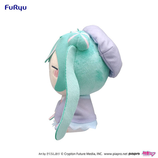 Charming Hatsune Miku MOCHIPICO plush toy in a Love Blazer, humming with eyes closed, featuring soft teal pigtails with pink bows, ideal for fans and collectors seeking a touch of music-inspired cuteness.