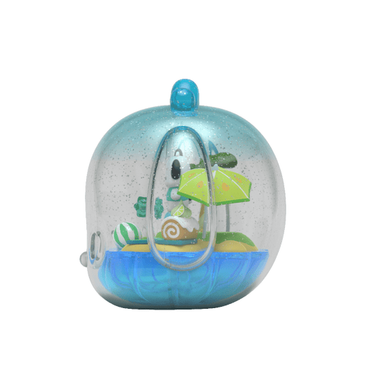 Kandyland: Sanrio Pochacco figure in a beach setting, with Pochacco lounging under a green umbrella surrounded by beach accessories, encased in a glitter-filled globe topped with a bright blue bow.
