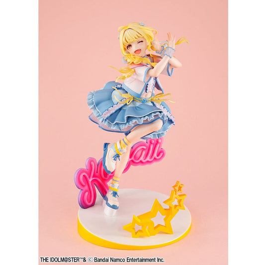 Lucrea Gakuen Idolmaster Kotone Fujita The World's Cutest Me Ver. Figure, featuring a joyful Kotone in a blue and yellow frilly dress, mid-jump above a pink 'kawaii' and yellow stars base.