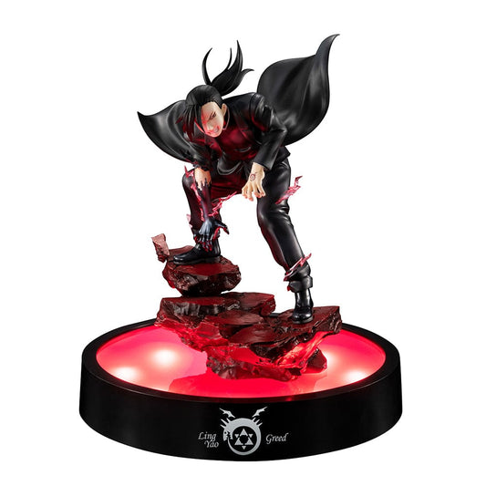 Precious G.E.M. FULLMETAL ALCHEMIST GREED (LingYao) figure in dynamic pose with LED base stand, featuring detailed black combat attire and a glowing red LED light enhancing the dramatic effect.