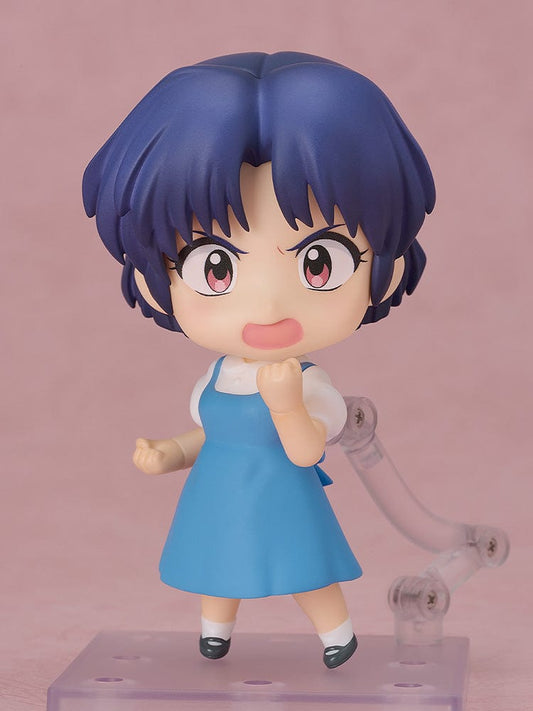 Charming Nendoroid figure of Akane Tendo from "Ranma 1/2," featuring her signature blue dress and holding her beloved pet P-chan. This figure showcases Akane's kind and strong character, making it a captivating piece for collectors and fans of the series.