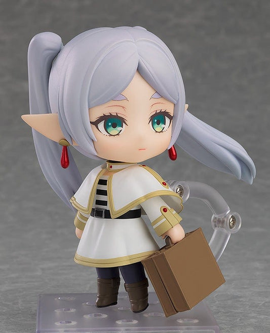 Frieren: Beyond Journey's End Nendoroid Frieren figure featuring silver twin tails, white mage cloak, and red gem-staff, standing on a display base.