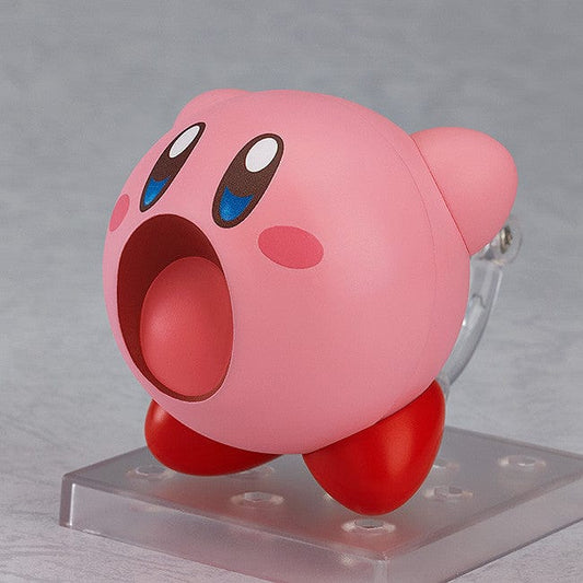 Kirby Nendoroid No. 544 (2nd Reissue) featuring an interchangeable, magnetized poseable figure of Kirby with a vibrant pink body, cheerful expression, and glossy red feet.