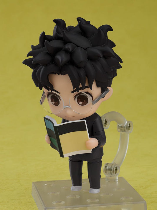 Dandadan Nendoroid No.2702 Okarun, featuring the character in a black suit with tousled hair, including a supernatural feline companion.