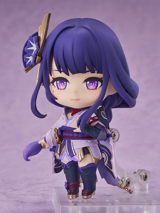 Nendoroid Raiden Shogun figure from Genshin Impact in purple and gold attire, holding her weapon, with a determined expression and detailed accessories.