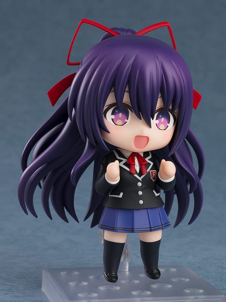 Nendoroid figure No.2454 of Tohka Yatogami from Date a Live, dressed in her school uniform, featuring her vibrant purple hair with red ribbons, starry eyes, and an endearing smile.