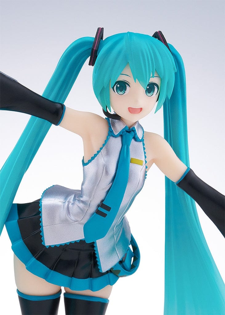Vocaloid Pop Up Parade Miku Hatsune in a translucent color version, with her iconic turquoise twintails and a cheerful expression. She is dressed in her signature outfit, modified with translucent elements that give her a luminous and ethereal appearance.