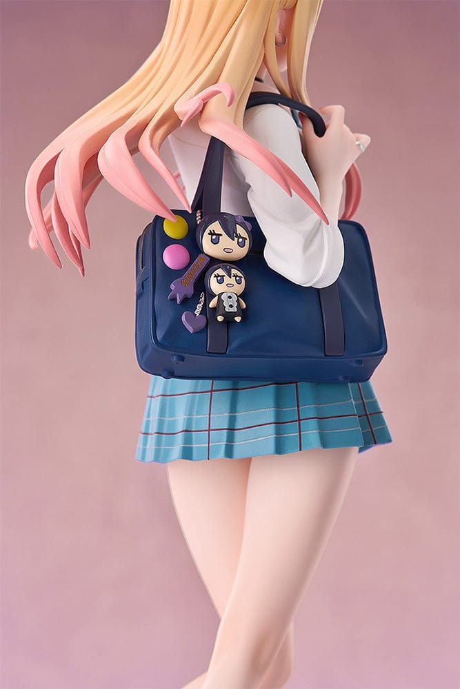 My Dress-Up Darling Pop Up Parade Marin Kitagawa figure, depicted in a school outfit with a vibrant smile and peace sign, blonde hair with pink streaks flowing, carrying a blue bag, set for display