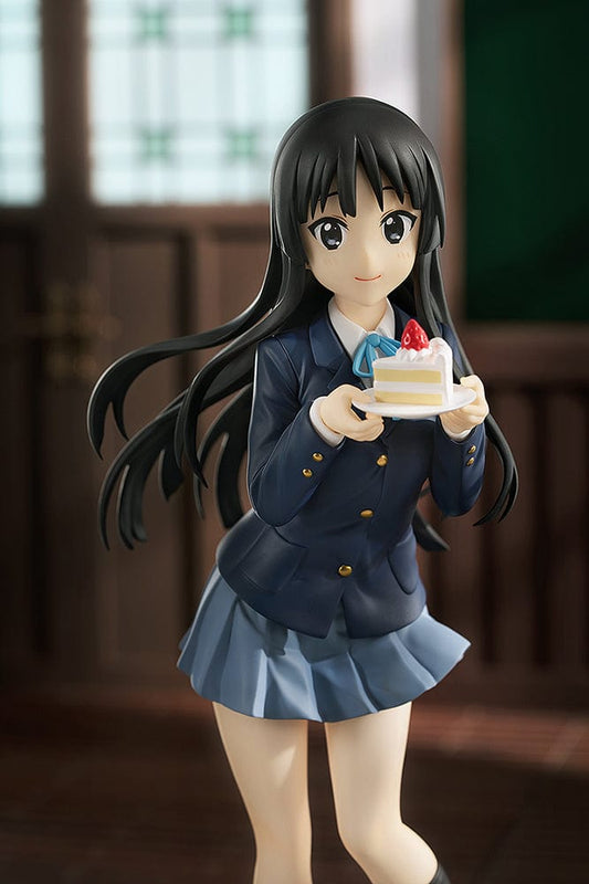 K-On! Pop Up Parade L Mio Akiyama figure presenting a piece of cake, in full school uniform, featuring flowing long black hair and a subtle smile.