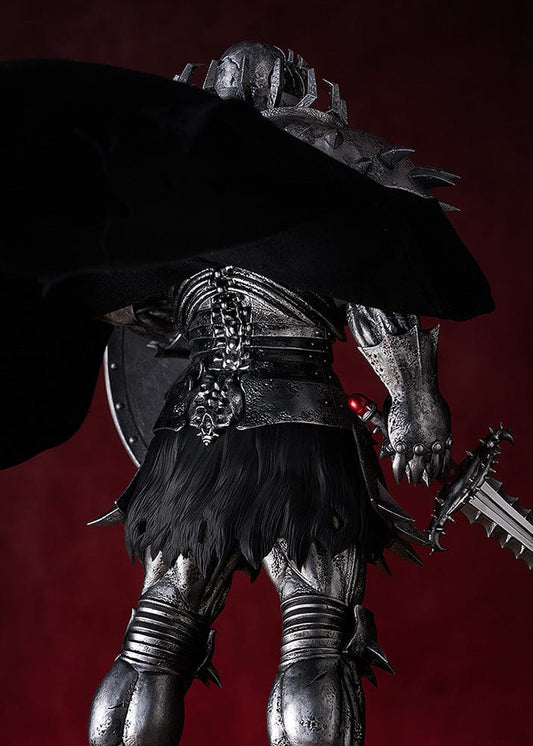 Large-scale figure of Skull Knight from Berserk in black armor with spiked pauldrons, holding a sword and shield, with a torn cape flowing behind.