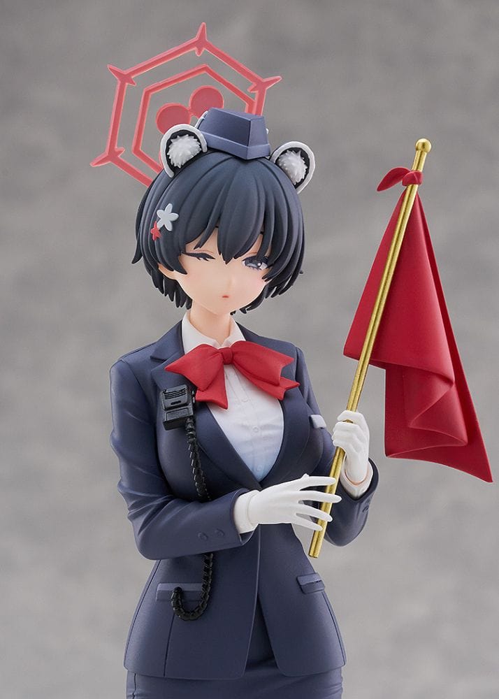 Blue Archive Pop Up Parade figure of Tsubaki Kasuga in her Guide uniform holding a red signal flag with eyes closed and a calm expression.