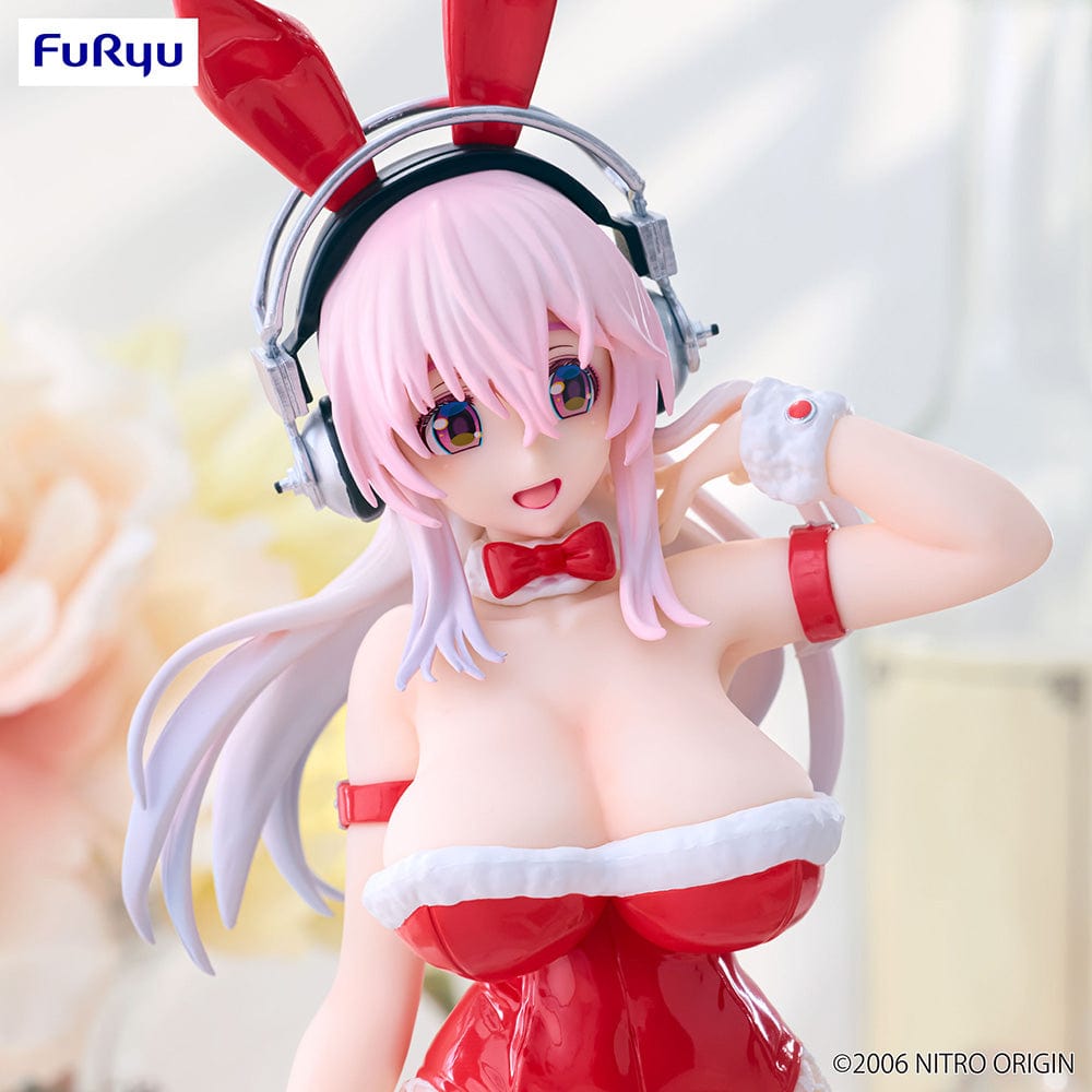 Super Sonico in BiCute Bunnies red bunny outfit, featuring red ears, glossy suit, and fishnet stockings, playfully posing with a charismatic smile, set on a plain white background.