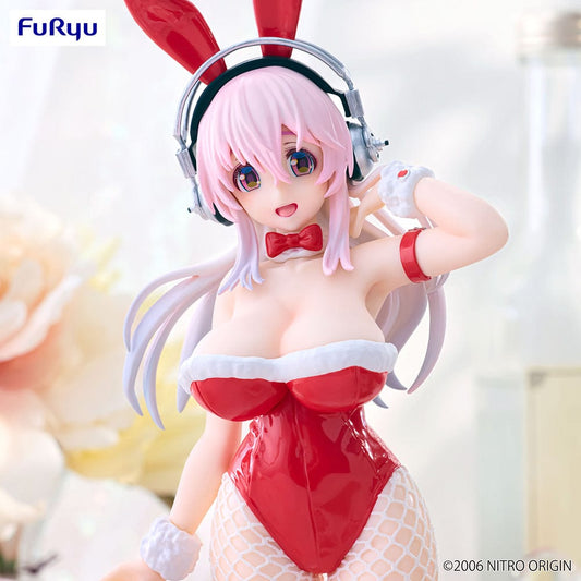 Super Sonico in BiCute Bunnies red bunny outfit, featuring red ears, glossy suit, and fishnet stockings, playfully posing with a charismatic smile, set on a plain white background.