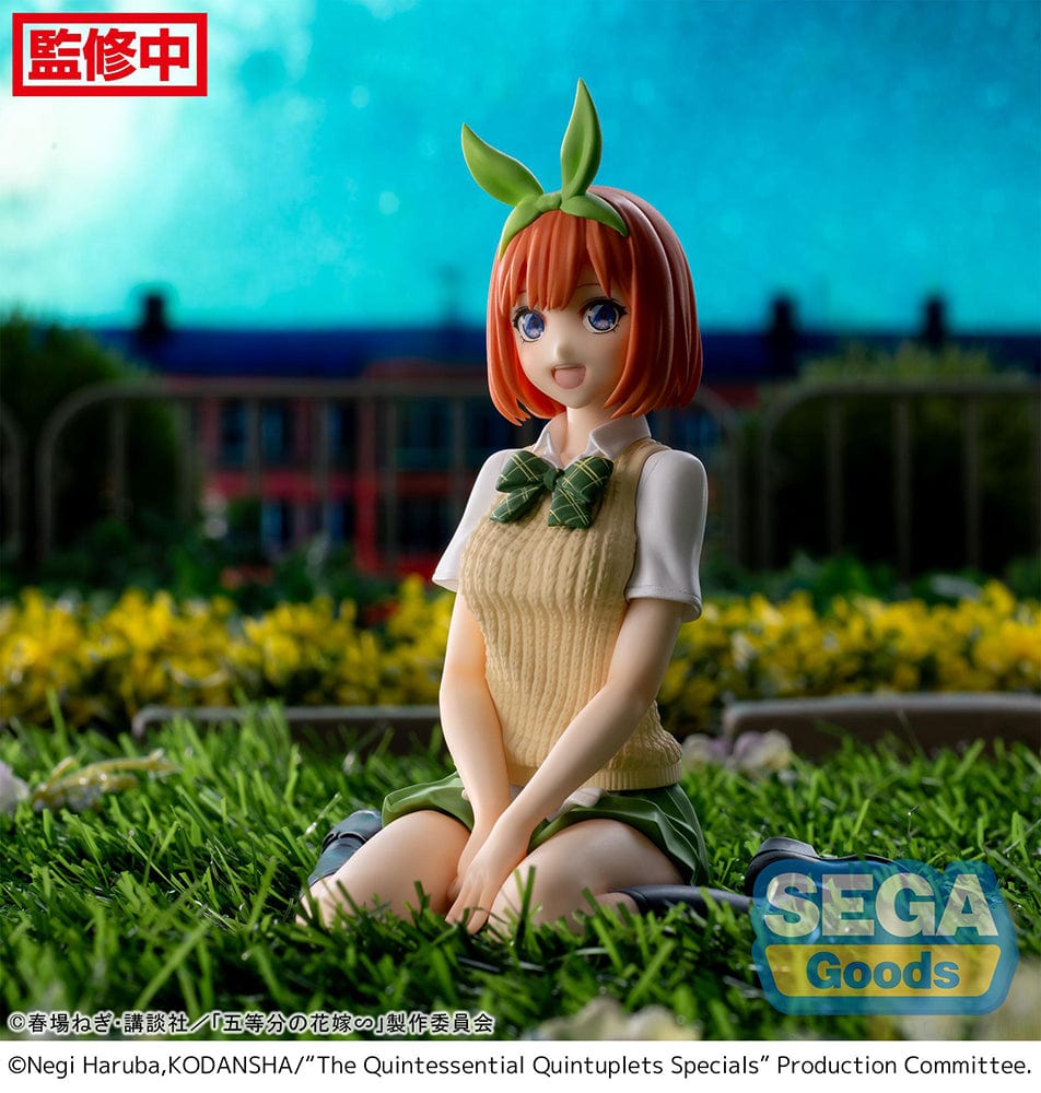 The Quintessential Quintuplets Yotsuba Nakano Premium Perching Figure, depicting Yotsuba in her signature outfit with bright orange hair and a cheerful smile, seated on a clear base.