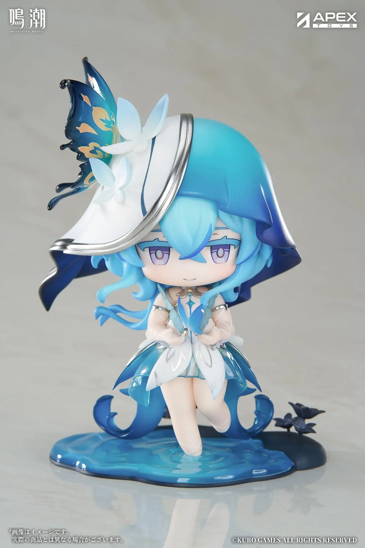 Chibi Shorekeeper Jinseki Series figure with blue hair, a butterfly-decorated headpiece, and a blue butterfly held in her hands, standing on a water-inspired base.