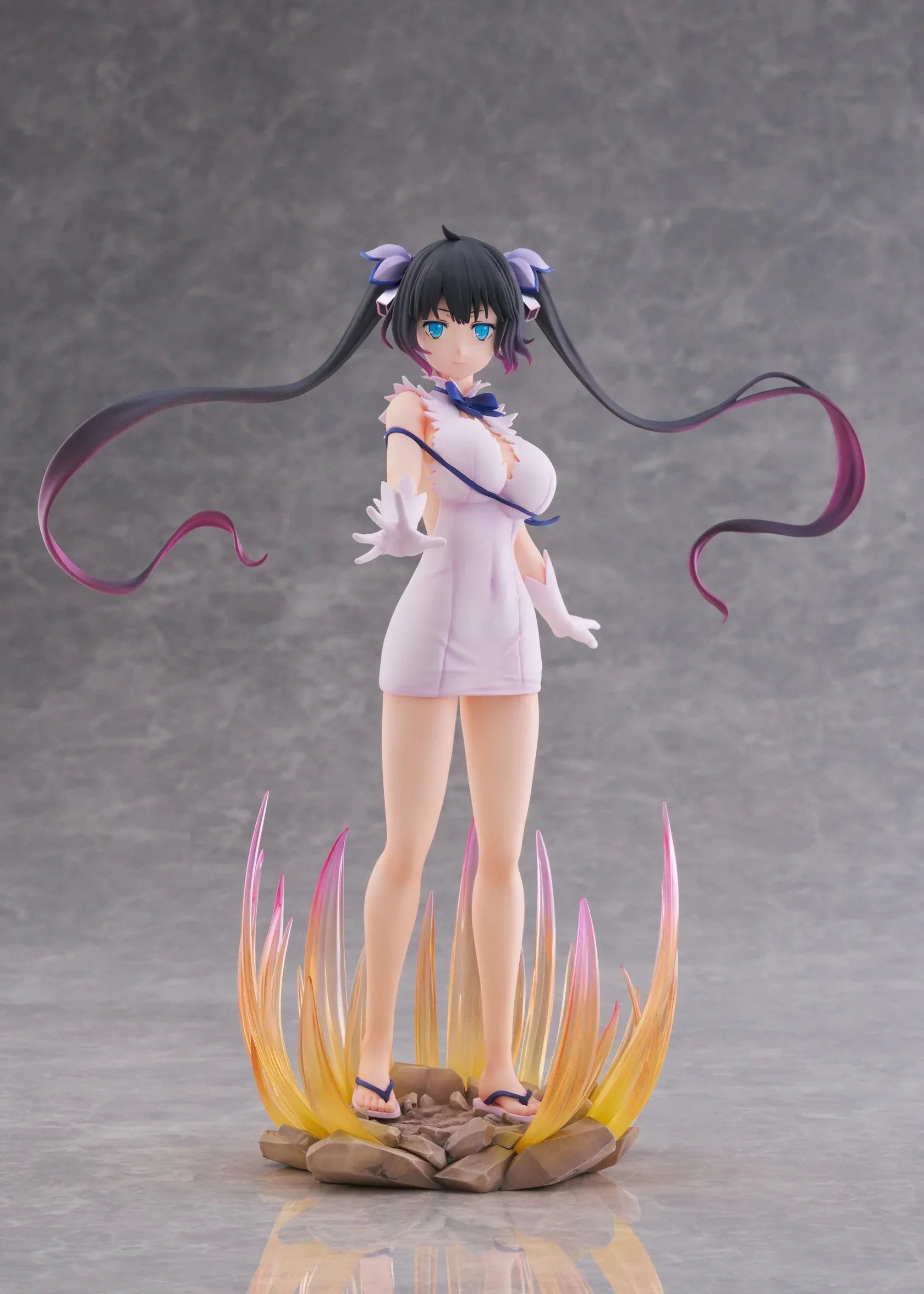 Is It Wrong to Try to Pick Up Girls in a Dungeon V Hestia Divinity Unleashed Limited Edition Ver. 1/7 Scale Figure with twin-tails, white outfit, blue ribbon accents, rocky base, and flame effect parts