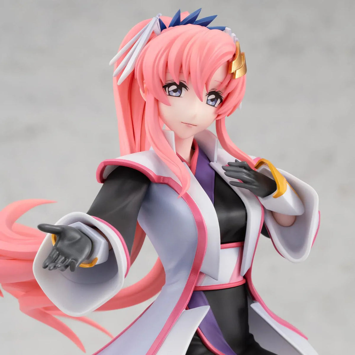 Gundam Girls Generation Lacus Clyne Battle Surcoat Ver. figure with flowing pink hair, a white surcoat with pink trim, and one gloved hand extended.