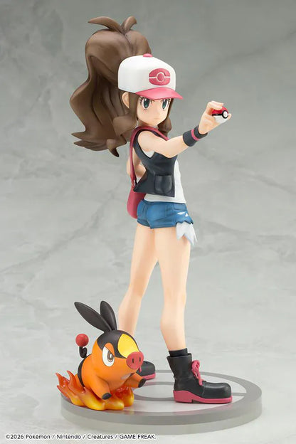 Pokemon ArtFX J Hilda with Tepig 1/8 Scale Figure Rerun featuring Hilda in her trainer outfit holding a Poké Ball with Tepig and flame effect on a display base.