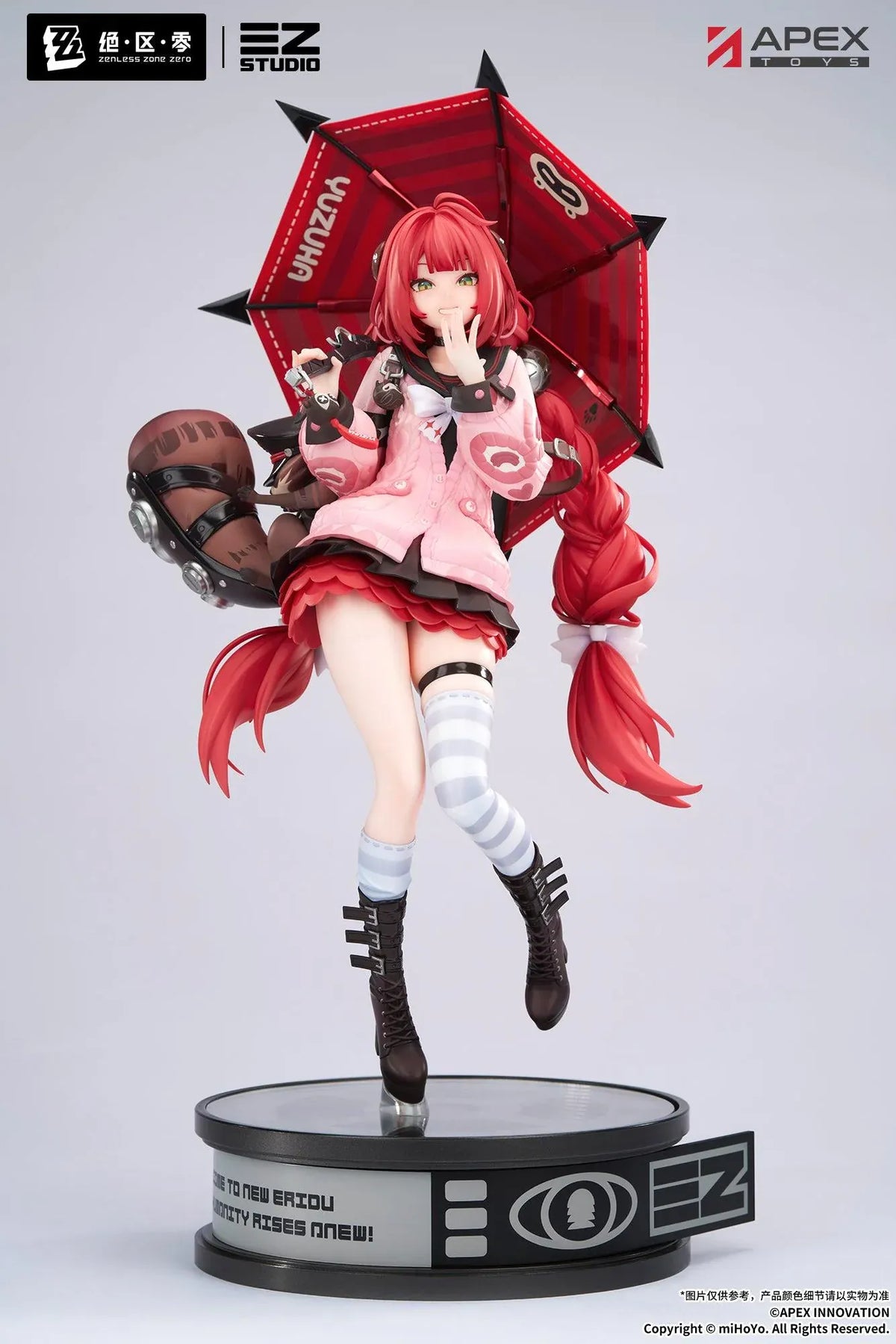 Zenless Zone Zero Yuzuha Ukinami 1/7 Scale Figure by APEX Toys featuring a red-haired anime girl with long braided twin-tails, green eyes, a pink jacket, layered red skirt, striped thigh-high stockings, and black boots while holding a large red umbrella on a circular display base.